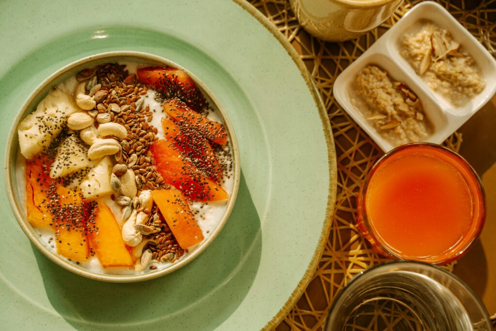 A vibrant breakfast bowl with yogurt, fruits, and seeds, perfect for a healthy morning start.