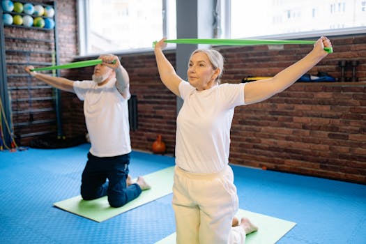 Elderly man and woman performing fitness workout with resistance bands, promoting healthy lifestyle indoors.